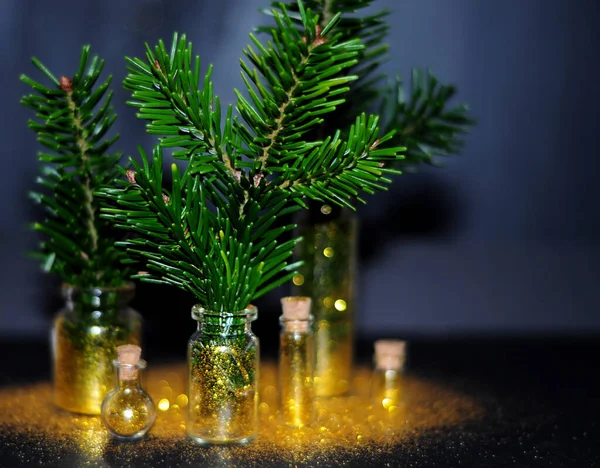 Spruce branches in glass jars with gold glitter — Stock Image Spruce Branches Glass Jars Gold Glitter Stock Image