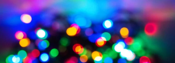 Bokeh der Weihnachtsgirlanden. Lichter aus Girlanden in Bokeh. — Stockfoto