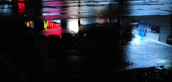 Abstract urban history, Lights and shadows, streets after rain with reflections on wet asphalt., horizontal image with blurred background, free space for text, defocus