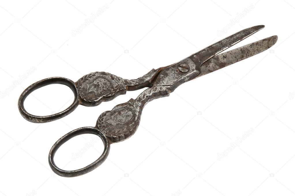 Old scissors isolated on white background.