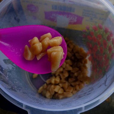 Sausage and nuggets fried with spicy spices on top, strawberry syrup drink