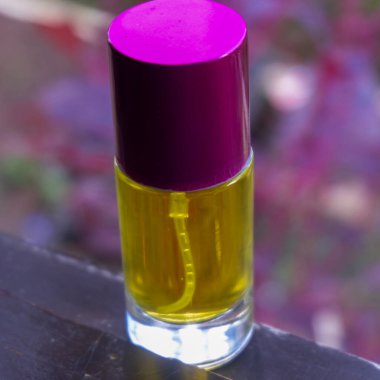 perfume bottle in yellow in the photo on the window of the house