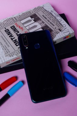 Close-up photos of smartphones, books and stationery