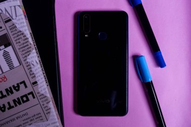 Close-up photos of smartphones, books and stationery