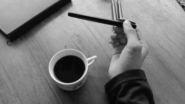 Photo Person Enjoying Cup Black Coffee Wooden Table — Stock Photo, Image