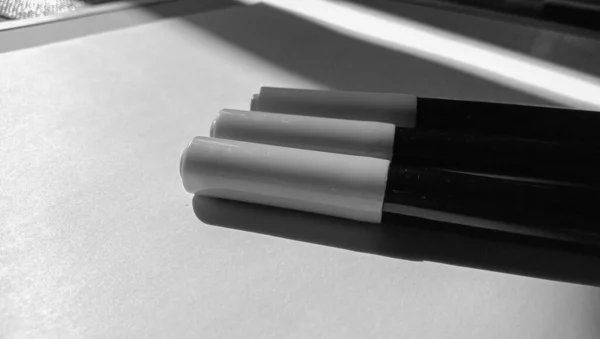 Photo of some markers on a white background