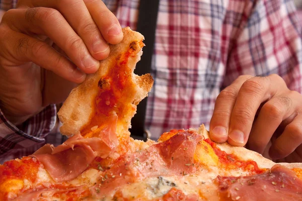 Eating italian pizza with hands