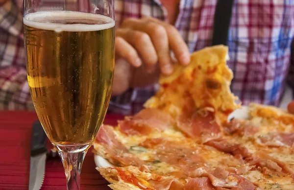 Eating with fingers the italian pizza