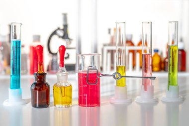 Close up view laboratory equipment, supplies and jars, bottles cylinders and beakers