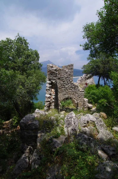 Stone ancient ruins. Mountain landscape with landmarks. Broken stone wall textures. Old buildings in the openair