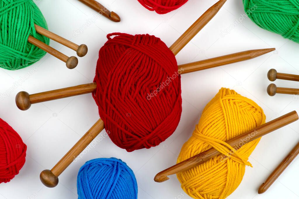 Craft knitting with bamboo crochet, set with knitting needles. Hobbies, handicrafts and handmade work. Threads, balls of yarn, skeins, bobbins, spools. Empty copy space.