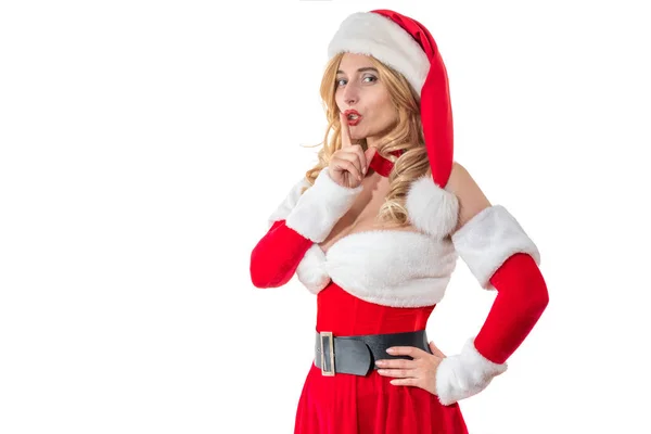 圣诞老人夫人高兴地微笑着 把食指靠近嘴唇 穿红衣服的漂亮女人 白毛皮 戴着圣诞老人帽子的快乐的女孩 女性看圣诞派对 — 图库照片