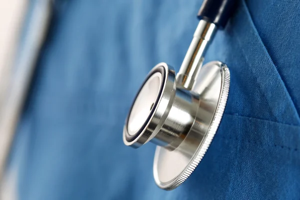 Stethoscope head lying on medicine therapeutist doctor chest — Stock Photo, Image