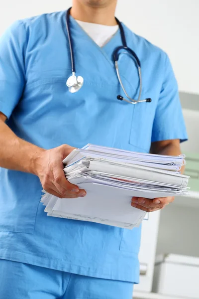 Hands of medicine therapeutist doctor wearing blue uniform