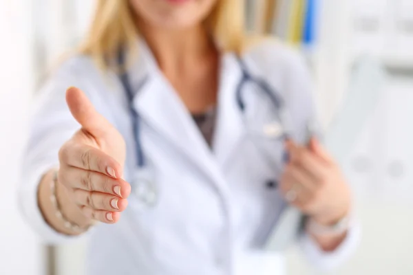 Female medicine doctor offering hand to shake — Stock Photo, Image