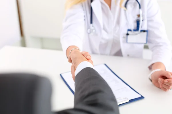 Female medicine doctor shake hand as hello — Stock Photo, Image