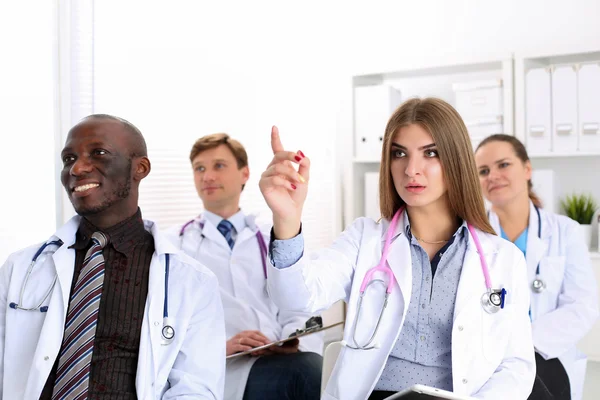 Group of doctors listen some presentation