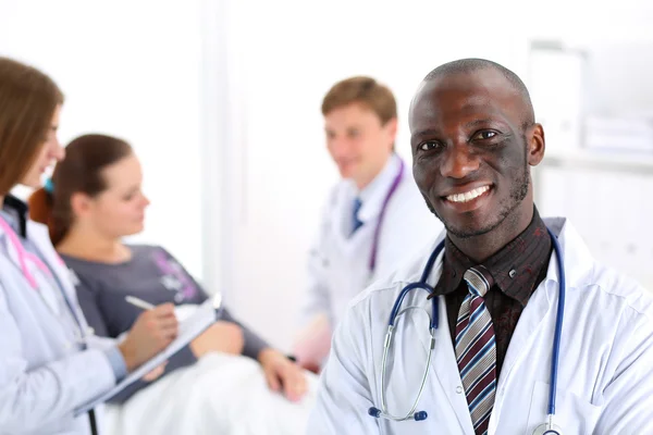 Black smiling male doctor look in camera