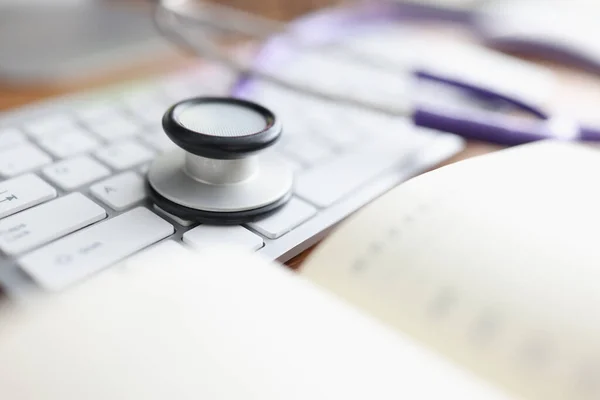 Stethoscope keyboard and diary on the table. — Stock Photo, Image