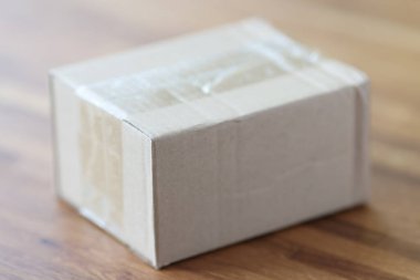 Cardboard packing box is on table closeup
