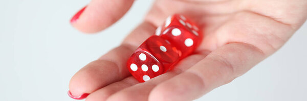 On hand are red dice with white marks