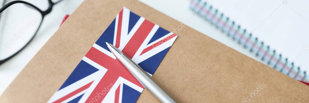 On table is diary with British flag and pen