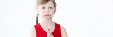 Portrait of little offended girl with blue eyes
