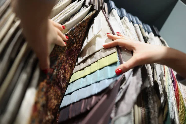 Multi-colored fabrics on exhibition stand in store — Stock Photo, Image