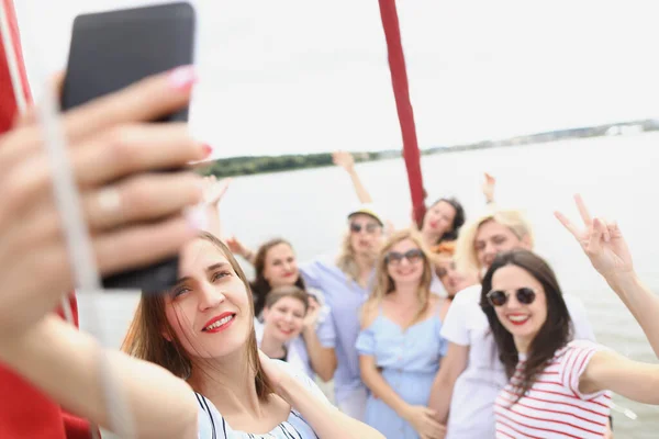 Cheerful women on board the boat take a selfie — Stock Photo, Image