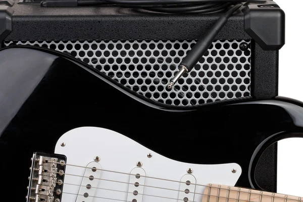 Guitar with amplifier and audio cord with jack closeup — Stock Photo, Image