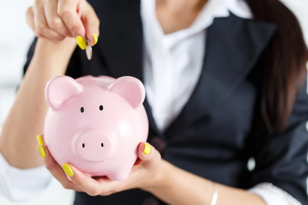 Piggy bank and woman — Stock Photo, Image