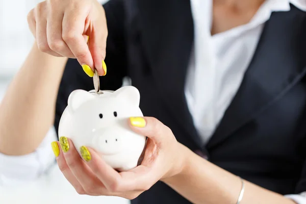 Piggy bank and woman — Stock Photo, Image