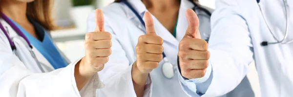 Three medicine doctor hands showing OK or approval sign — Zdjęcie stockowe