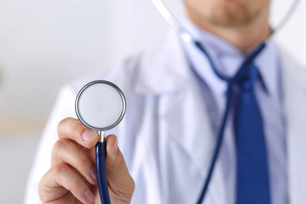 Male medicine doctor hand holding stethoscope head — Stock Photo, Image