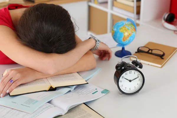 Tired female student at workplace — Zdjęcie stockowe