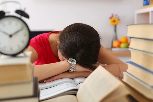 Tired female student at workplace — Stockfoto