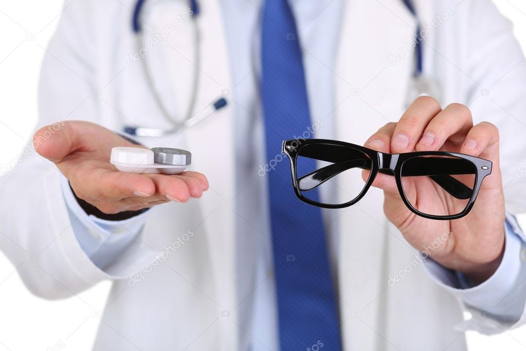 Male doctor hands giving pair of black glasses