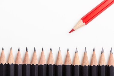 Red pencil standing out from crowd clipart