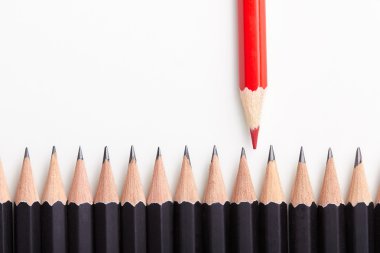Red pencil standing out from crowd clipart