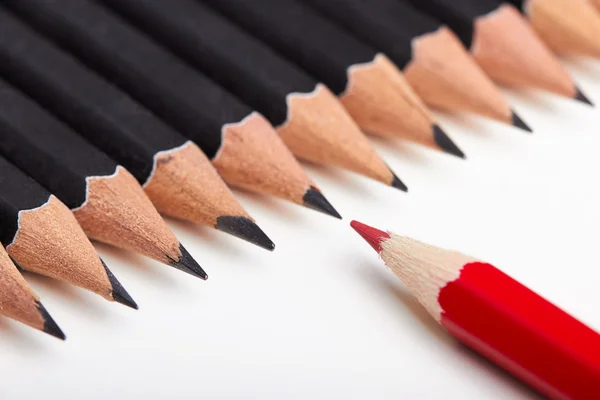 Red pencil standing out from crowd — Stock Photo, Image