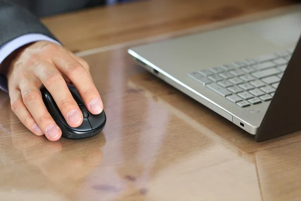 Hands of businessman in suit holding computer wireless mouse — Stock Photo, Image