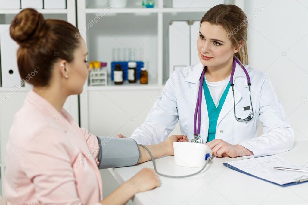 Smiling cheerful female medicine doctor with pretty face