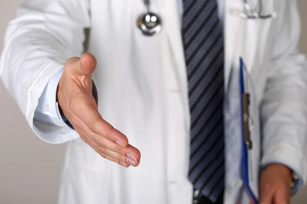 Male medicine doctor offering hand to shake closeup — Stock Photo, Image