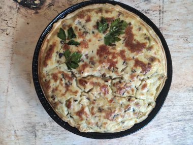 pie with fish, crushed potatoes, spices and olive oil