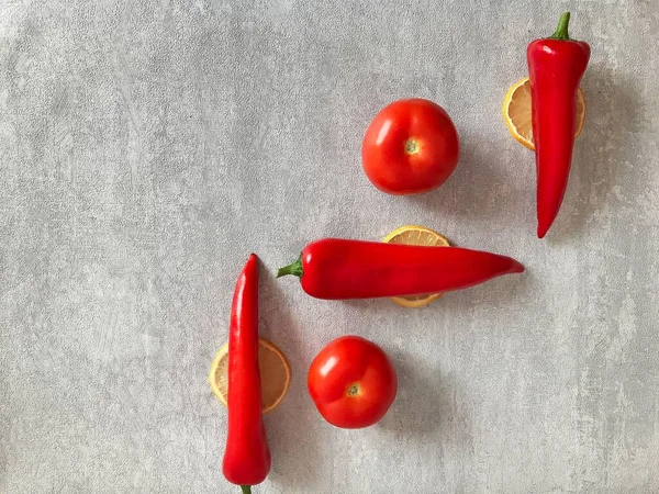 red, fresh peppers on the table. Minimal healthy food concept. Detox menu set, Spicy meal veg fruit cook. Art design card shot above table. Flat lay view close up copy space for text.