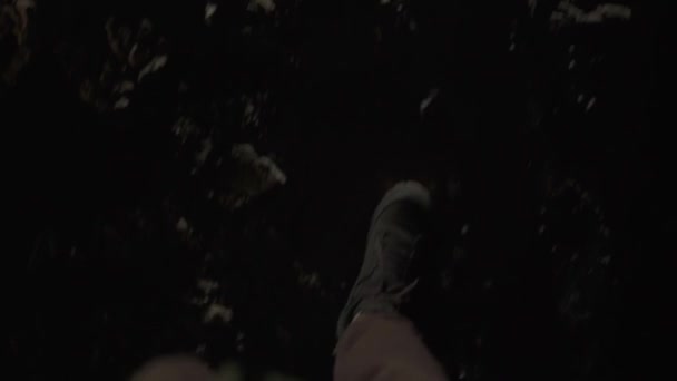 First person view on a mans legs walking in the dark on destructed floor — Vídeo de stock