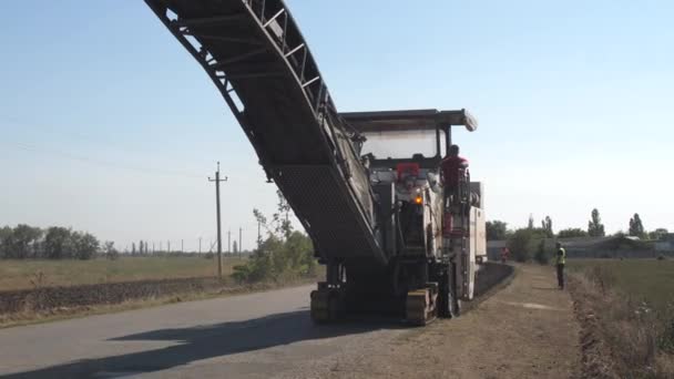 View from curb footage of a country road under renovation. — стоковое видео