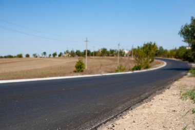 New road trough nowhere on countryside terrain