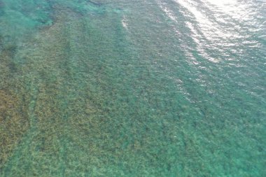 Turquoise clear calm water of the Indian Ocean near the shore. 