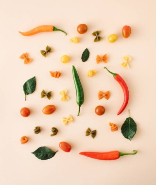 Italian pasta, various shapes with fresh juicy vegetables and spices. chilli pappers, tomato. creative cooking. healthy cooking.